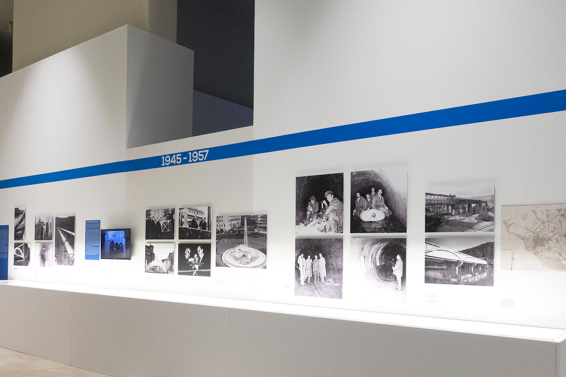 Photo of a wall displaying all the photos from the period 1945-1957 relating to the Peschiera aqueduct.