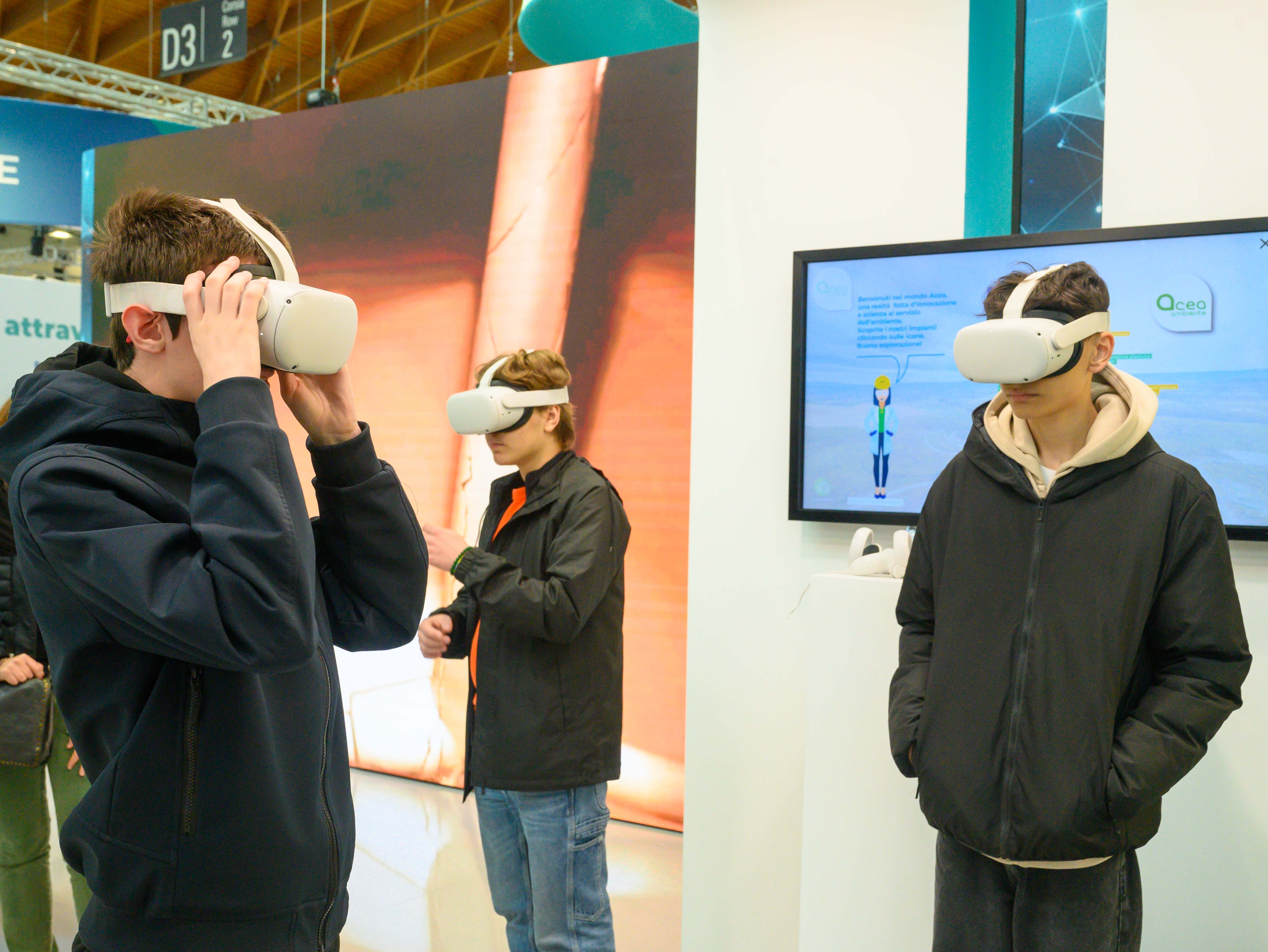 Three boys wear virtual reality visors
