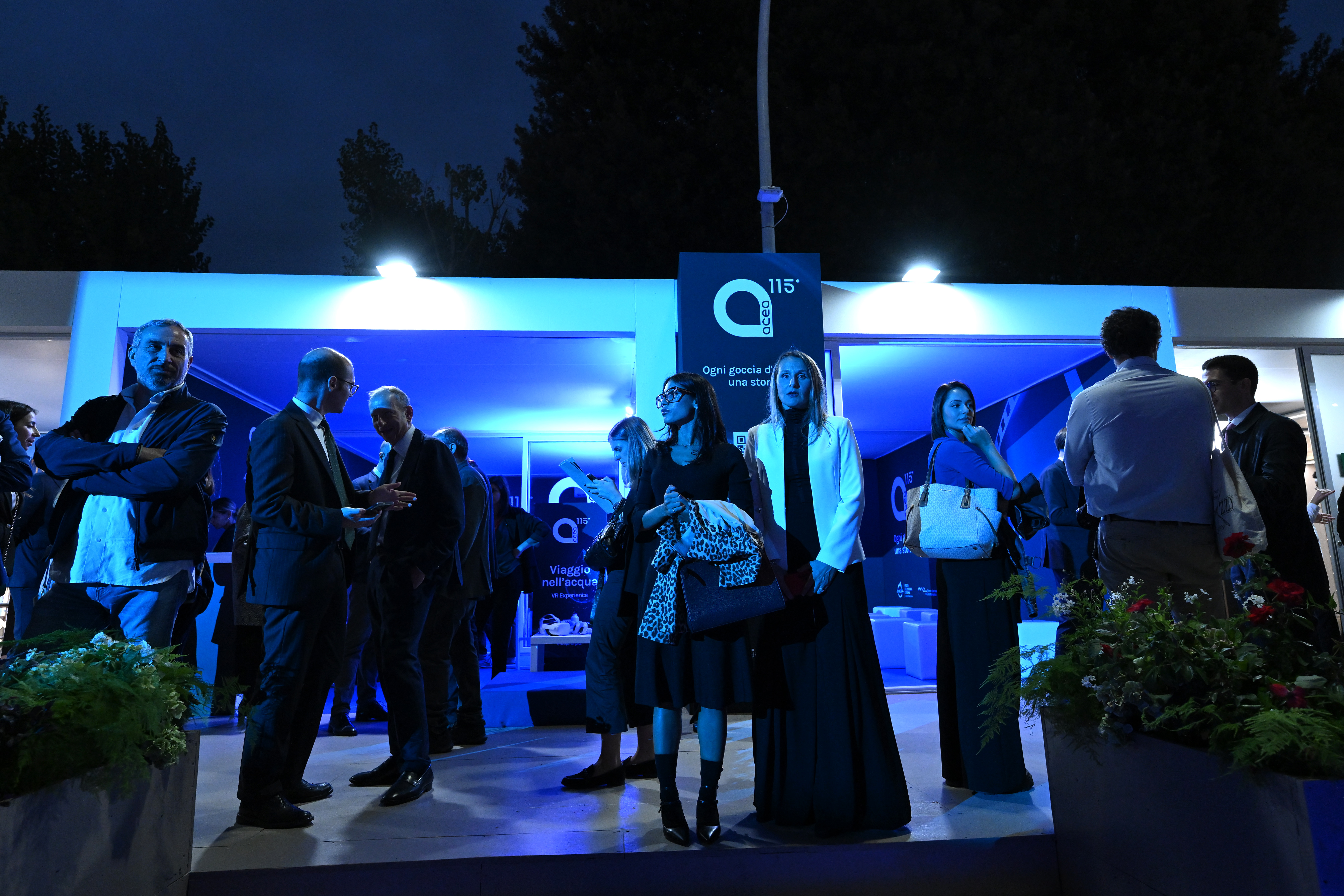 people in front of the entrance to the event