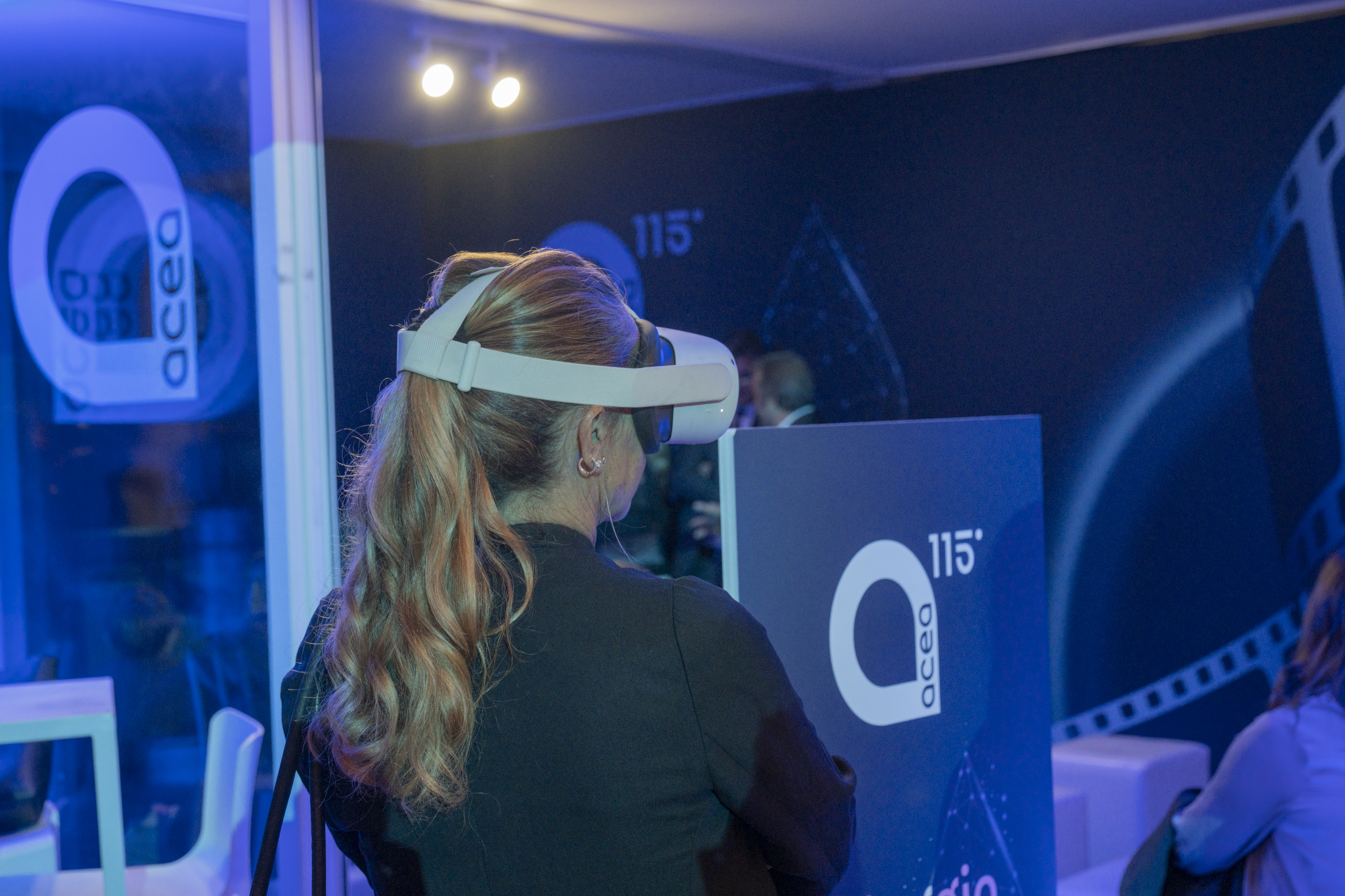 girl from behind wearing a VR headset