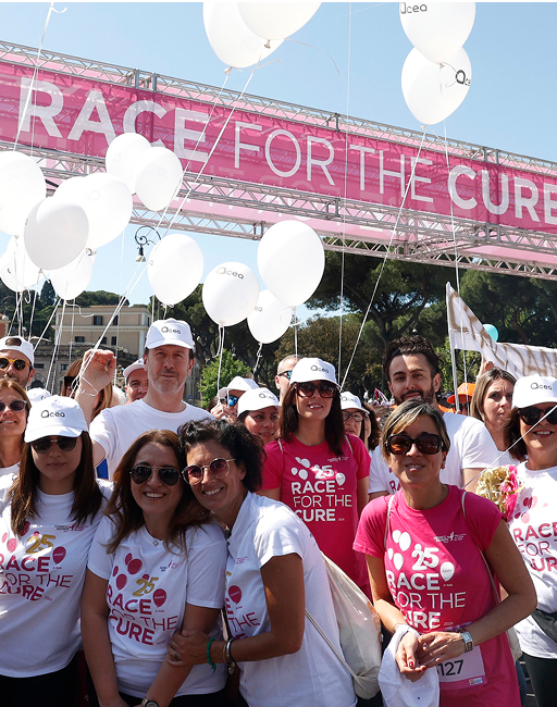 Group of Acea's employees smile at the camera during the Acea Run for the Cure event